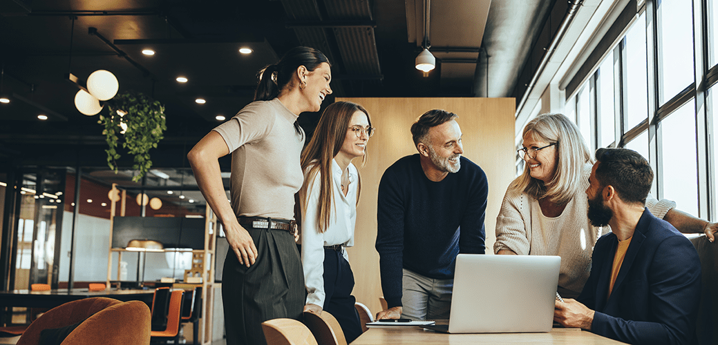 Smiling businesspeople having a discussion in an office 
by Jacob Lund